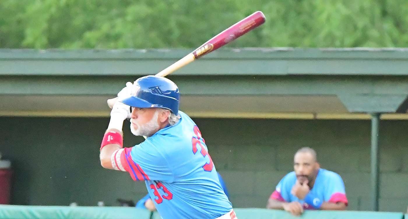 Still swinging early in the 2026 town ball baseball season, Steve Schmitz shows his Monarchs teammates how to hit with two strikes with this base hit against the Chaska Cubs.